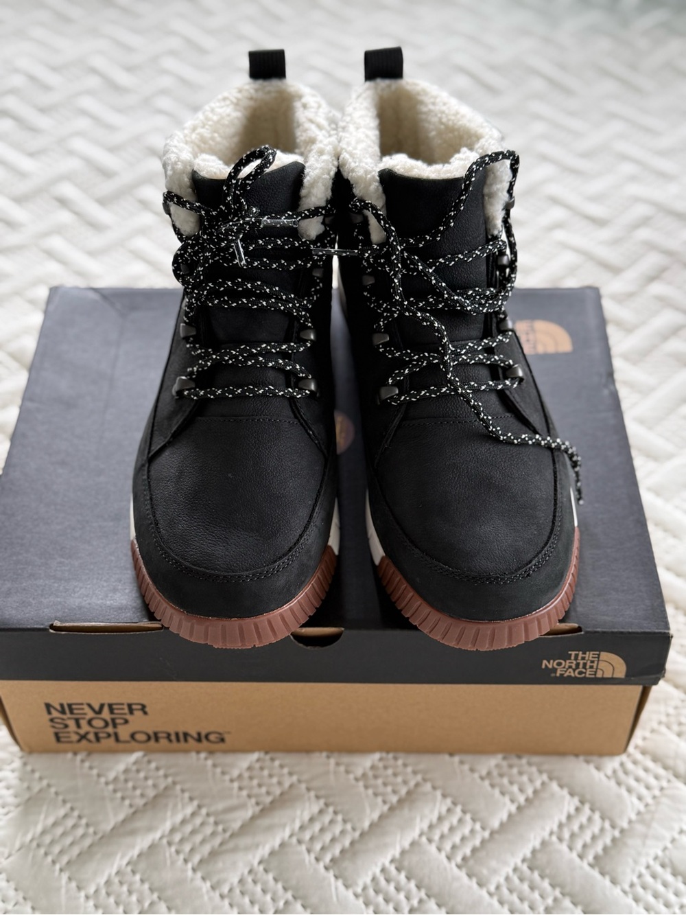The North Face Black Boot with Brown Sole and Cream Sherpa Collar